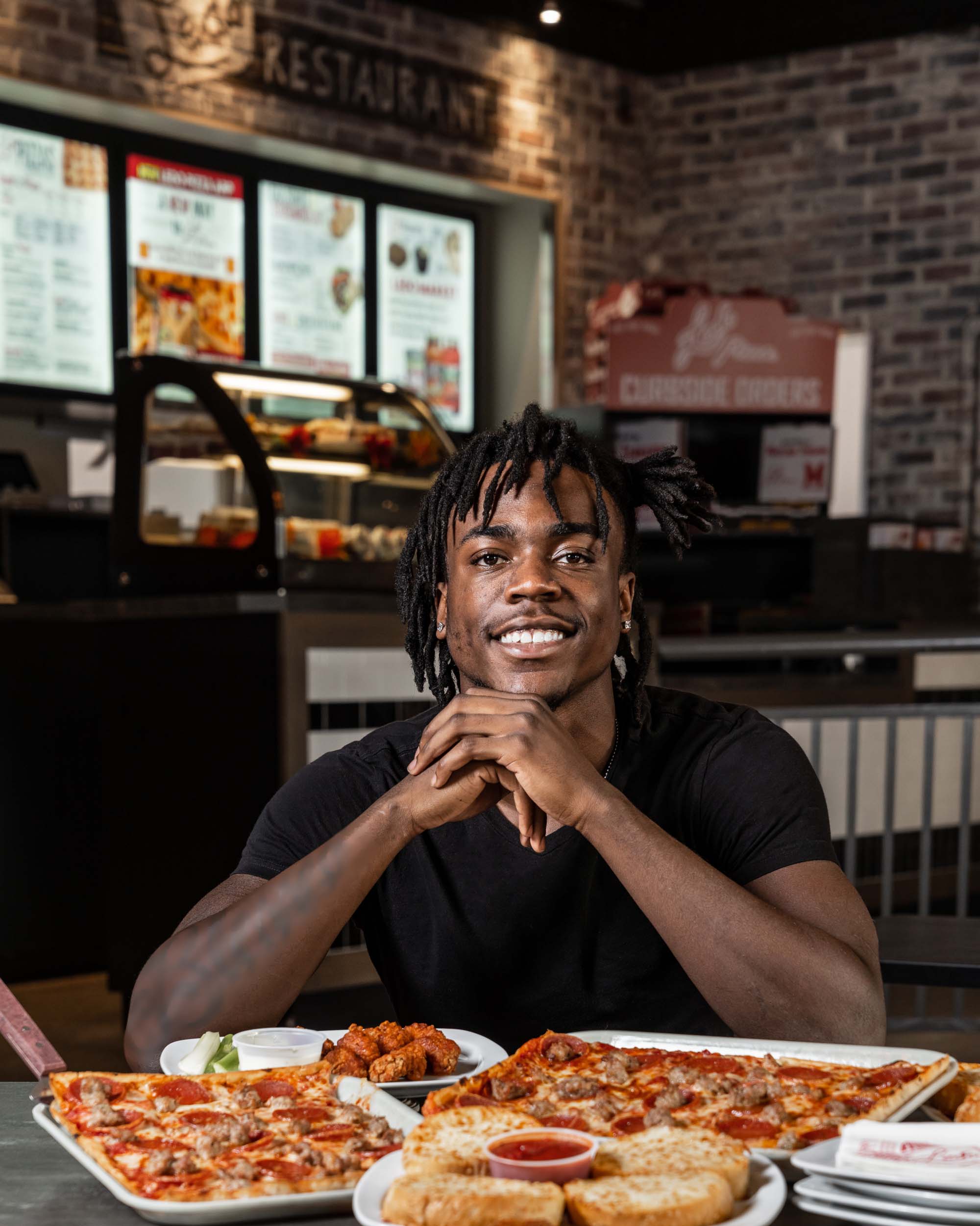 Ledo Pizza Partners with University of Maryland Wide Receiver Dontay Demus Jr. table shot